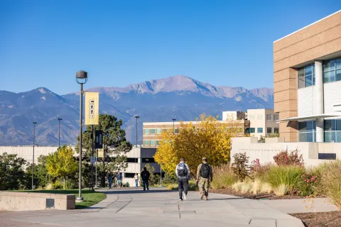 students walk across campus